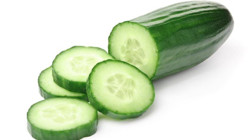 Cucumber and slices isolated over white background.