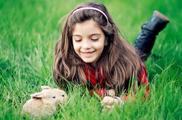 happy-girl-playing-with-rabbits-wallpaper