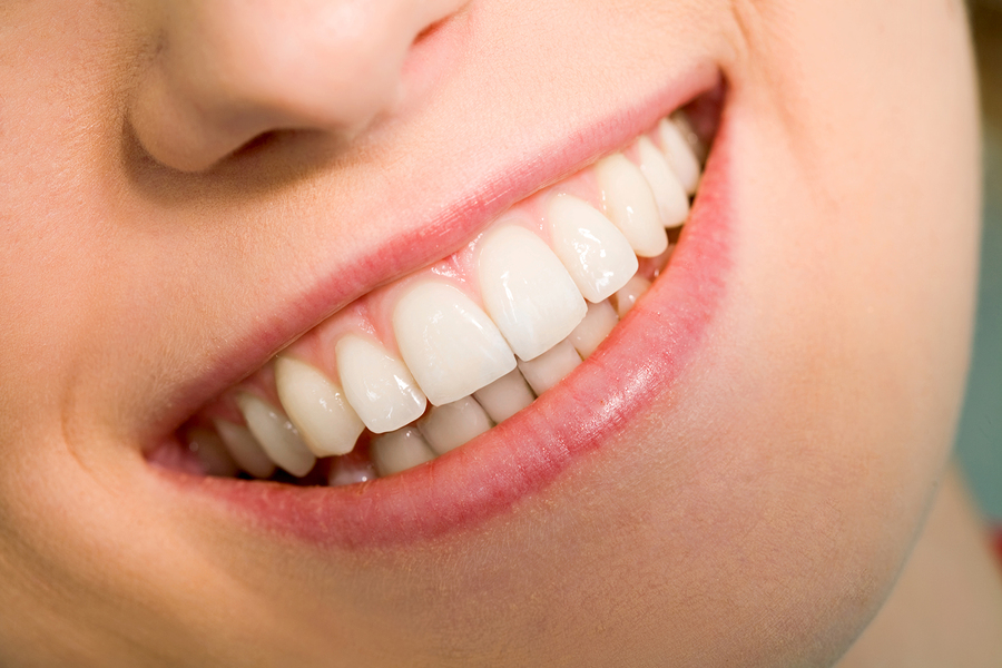 Close-up of happy female smile and healthy teeth