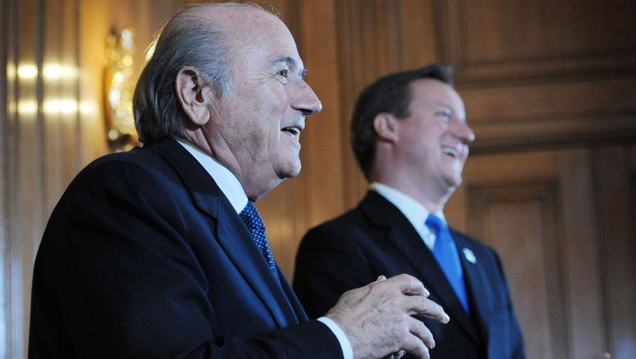 LONDON, ENGLAND - OCTOBER 13:  Prime Minister David Cameron (R) looks on as President of FIFA Sepp Blatter speaks to the media at number 10 Downing Street on October 13, 2010 in London, England. Cameron and Baltter discussed England's bid for the 2018 World Cup after meeting with Government ministers and bid ambassadors.  (Photo by Stefan Rousseau - WPA Pool/Getty Images)