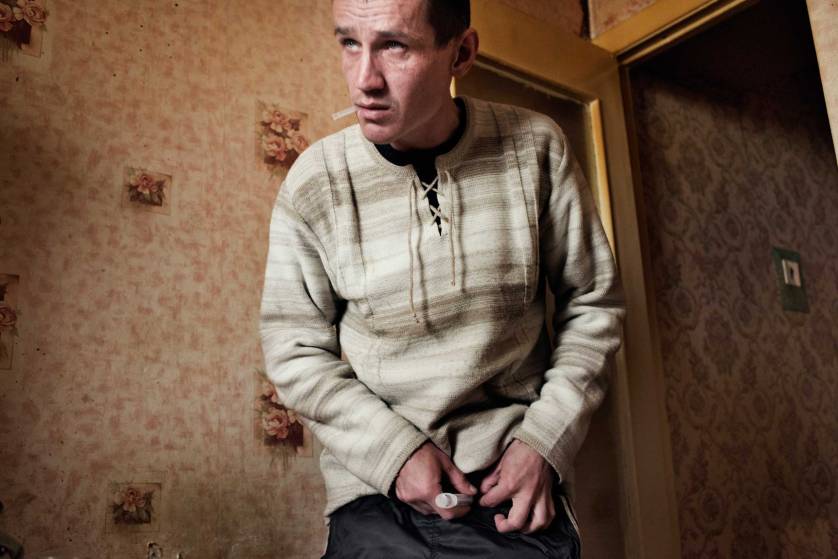 The following photographs were taken in Yekaterinburg, Russia in 2013. Alexei, age 33, injects a dose of krokodil. Because of his dependence on krokodil, Alexei has injuries and swelling around his feet and is forced to walk with a cane.