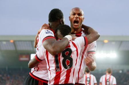 Britain Football Soccer - Sunderland v Everton - Barclays Premier League - The Stadium of Light - 11/5/16 Lamine Kone celebrates scoring the third goal for Sunderland with Younes Kaboul and Jermain Defoe Action Images via Reuters / Jason Cairnduff