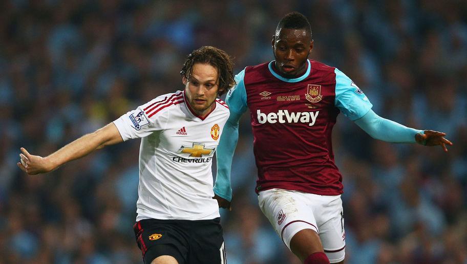 LONDON, ENGLAND - MAY 10: Daley Blind of Manchester United holds off Diafra Sakho of West Ham United during the Barclays Premier League match between West Ham United and Manchester United at the Boleyn Ground on May 10, 2016 in London, England. West Ham United are playing their last ever home match at the Boleyn Ground after their 112 year stay at the stadium. The Hammers will move to the Olympic Stadium for the 2016-17 season. (Photo by Paul Gilham/Getty Images)