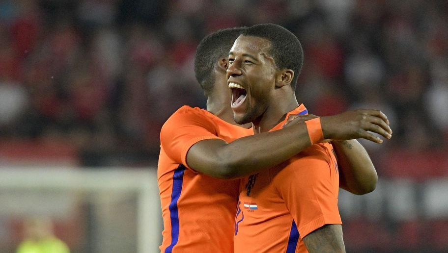 Netherlands' Georginio Wijnaldum celebtrates with a teammate after scoring the 2:0 lead during the EURO 2016 friendly football match Austria vs Netherlands at Ernst Happel stadium in Vienna, on June 4, 2016. / AFP / APA / HERBERT NEUBAUER / Austria OUT (Photo credit should read HERBERT NEUBAUER/AFP/Getty Images)