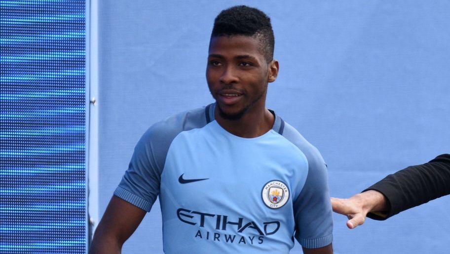 Spanish football manager Pep Guardiola (R) greets Manchester City's Nigerian striker Kelechi Iheanacho (L) as Guardiola is officially unveiled as the club's new manager at the City Football Academy in Manchester, north west England on July 3, 2016. / AFP / OLI SCARFF        (Photo credit should read OLI SCARFF/AFP/Getty Images)