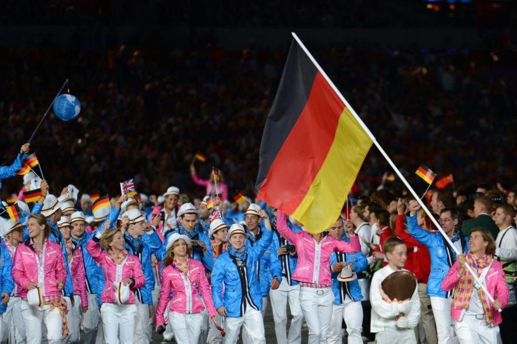 LONDON, ENGLAND - JULY 27:  Natascha Keller of the Germany Olympic hockey team carries her country's flag during the Opening Ceremony of the London 2012 Olympic Games at the Olympic Stadium on July 27, 2012 in London, England.  (Photo by Lars Baron/Getty Images)