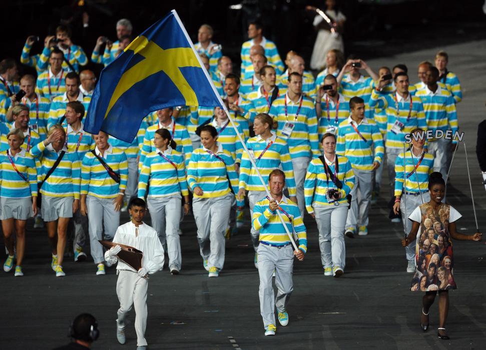 LONDON, ENGLAND - JULY 27:  Rolf-Goran Bengtsson of the Sweden Olympic equestrian team carries his country's flag during the Opening Ceremony of the London 2012 Olympic Games at the Olympic Stadium on July 27, 2012 in London, England.  (Photo by Laurence Griffiths/Getty Images)