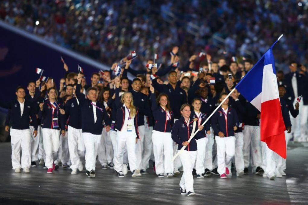 BAKU, AZERBAIJAN - JUNE 12:  Flag bearer and shooter, Celine Goberville of France leads her team into the stadium during the Opening Ceremony for the Baku 2015 European Games at the Olympic Stadium on June 12, 2015 in Baku, Azerbaijan.  (Photo by Francois Nel/Getty Images for BEGOC)